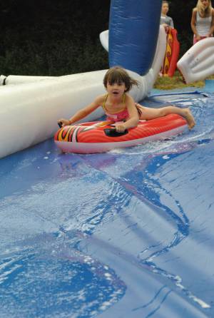 Ilminster Town FC fun day Part 1 – July 9, 2016: A giant water slide was the star attraction at a family fun day held to celebrate Ilminster Town Football Club’s new Archie Gooch Pavilion headquarters in Britten’s Field. Photo 10