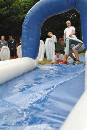 Ilminster Town FC fun day Part 1 – July 9, 2016: A giant water slide was the star attraction at a family fun day held to celebrate Ilminster Town Football Club’s new Archie Gooch Pavilion headquarters in Britten’s Field. Photo 16