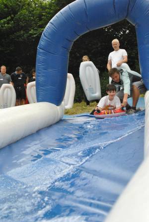 Ilminster Town FC fun day Part 1 – July 9, 2016: A giant water slide was the star attraction at a family fun day held to celebrate Ilminster Town Football Club’s new Archie Gooch Pavilion headquarters in Britten’s Field. Photo 17