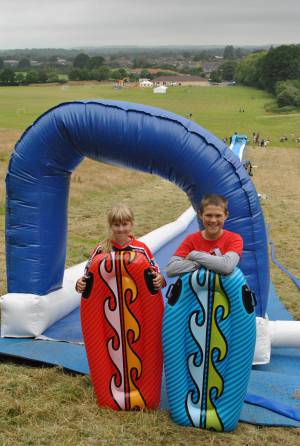 Ilminster Town FC fun day Part 1 – July 9, 2016: A giant water slide was the star attraction at a family fun day held to celebrate Ilminster Town Football Club’s new Archie Gooch Pavilion headquarters in Britten’s Field. Photo 1