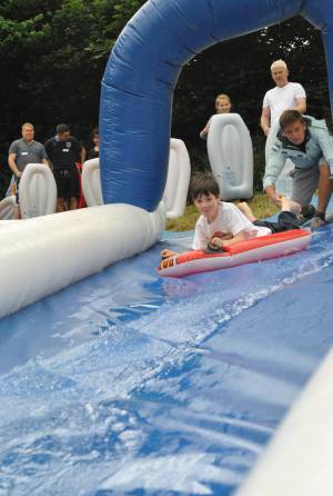 Ilminster Town FC fun day Part 1 – July 9, 2016: A giant water slide was the star attraction at a family fun day held to celebrate Ilminster Town Football Club’s new Archie Gooch Pavilion headquarters in Britten’s Field. Photo 18