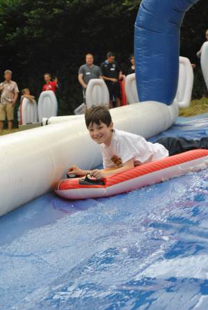 Ilminster Town FC fun day Part 1 – July 9, 2016: A giant water slide was the star attraction at a family fun day held to celebrate Ilminster Town Football Club’s new Archie Gooch Pavilion headquarters in Britten’s Field. Photo 19