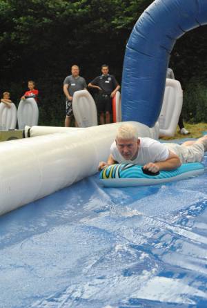 Ilminster Town FC fun day Part 1 – July 9, 2016: A giant water slide was the star attraction at a family fun day held to celebrate Ilminster Town Football Club’s new Archie Gooch Pavilion headquarters in Britten’s Field. Photo 22