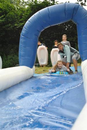 Ilminster Town FC fun day Part 1 – July 9, 2016: A giant water slide was the star attraction at a family fun day held to celebrate Ilminster Town Football Club’s new Archie Gooch Pavilion headquarters in Britten’s Field. Photo 24
