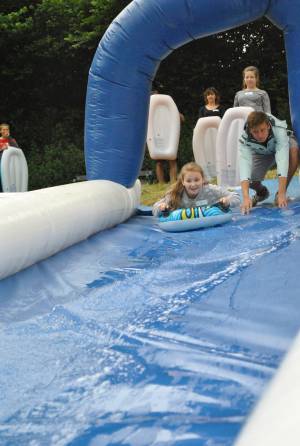 Ilminster Town FC fun day Part 1 – July 9, 2016: A giant water slide was the star attraction at a family fun day held to celebrate Ilminster Town Football Club’s new Archie Gooch Pavilion headquarters in Britten’s Field. Photo 25