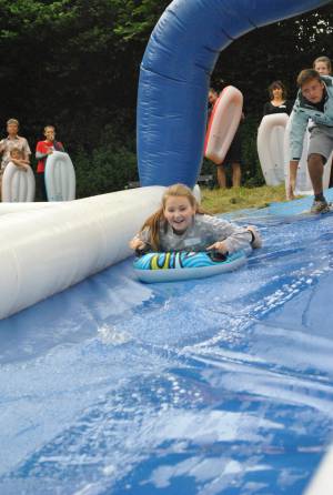 Ilminster Town FC fun day Part 1 – July 9, 2016: A giant water slide was the star attraction at a family fun day held to celebrate Ilminster Town Football Club’s new Archie Gooch Pavilion headquarters in Britten’s Field. Photo 26