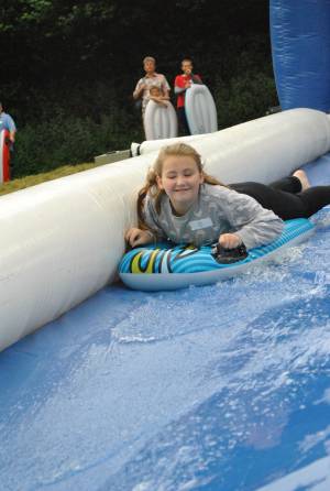 Ilminster Town FC fun day Part 1 – July 9, 2016: A giant water slide was the star attraction at a family fun day held to celebrate Ilminster Town Football Club’s new Archie Gooch Pavilion headquarters in Britten’s Field. Photo 27