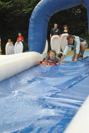 Ilminster Town FC fun day Part 1 – July 9, 2016: A giant water slide was the star attraction at a family fun day held to celebrate Ilminster Town Football Club’s new Archie Gooch Pavilion headquarters in Britten’s Field. Photo 28