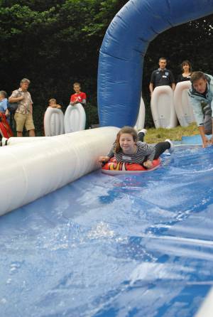Ilminster Town FC fun day Part 1 – July 9, 2016: A giant water slide was the star attraction at a family fun day held to celebrate Ilminster Town Football Club’s new Archie Gooch Pavilion headquarters in Britten’s Field. Photo 29