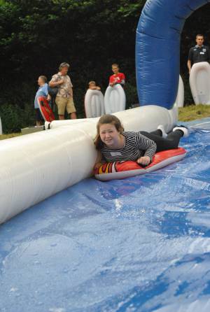 Ilminster Town FC fun day Part 1 – July 9, 2016: A giant water slide was the star attraction at a family fun day held to celebrate Ilminster Town Football Club’s new Archie Gooch Pavilion headquarters in Britten’s Field. Photo 30