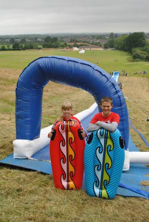 Ilminster Town FC fun day Part 1 – July 9, 2016: A giant water slide was the star attraction at a family fun day held to celebrate Ilminster Town Football Club’s new Archie Gooch Pavilion headquarters in Britten’s Field. Photo 3