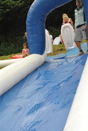 Ilminster Town FC fun day Part 1 – July 9, 2016: A giant water slide was the star attraction at a family fun day held to celebrate Ilminster Town Football Club’s new Archie Gooch Pavilion headquarters in Britten’s Field. Photo 5