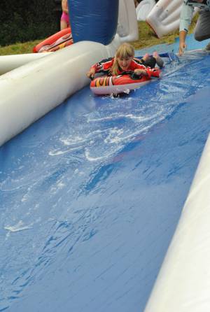 Ilminster Town FC fun day Part 1 – July 9, 2016: A giant water slide was the star attraction at a family fun day held to celebrate Ilminster Town Football Club’s new Archie Gooch Pavilion headquarters in Britten’s Field. Photo 7
