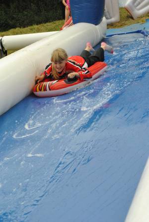 Ilminster Town FC fun day Part 1 – July 9, 2016: A giant water slide was the star attraction at a family fun day held to celebrate Ilminster Town Football Club’s new Archie Gooch Pavilion headquarters in Britten’s Field. Photo 8