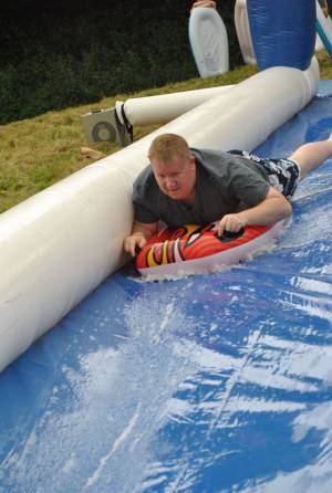 Ilminster Town FC fun day Part 2 – July 9, 2016: A giant water slide was the star attraction at a family fun day held to celebrate Ilminster Town Football Club’s new Archie Gooch Pavilion headquarters in Britten’s Field. Photo 11