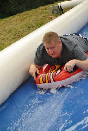 Ilminster Town FC fun day Part 2 – July 9, 2016: A giant water slide was the star attraction at a family fun day held to celebrate Ilminster Town Football Club’s new Archie Gooch Pavilion headquarters in Britten’s Field. Photo 12
