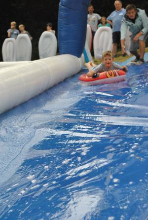 Ilminster Town FC fun day Part 2 – July 9, 2016: A giant water slide was the star attraction at a family fun day held to celebrate Ilminster Town Football Club’s new Archie Gooch Pavilion headquarters in Britten’s Field. Photo 13