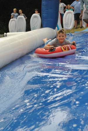 Ilminster Town FC fun day Part 2 – July 9, 2016: A giant water slide was the star attraction at a family fun day held to celebrate Ilminster Town Football Club’s new Archie Gooch Pavilion headquarters in Britten’s Field. Photo 14