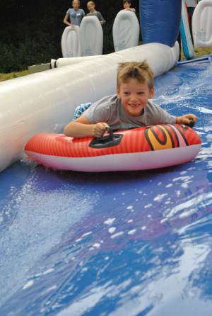 Ilminster Town FC fun day Part 2 – July 9, 2016: A giant water slide was the star attraction at a family fun day held to celebrate Ilminster Town Football Club’s new Archie Gooch Pavilion headquarters in Britten’s Field. Photo 15