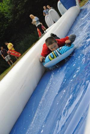 Ilminster Town FC fun day Part 2 – July 9, 2016: A giant water slide was the star attraction at a family fun day held to celebrate Ilminster Town Football Club’s new Archie Gooch Pavilion headquarters in Britten’s Field. Photo 16