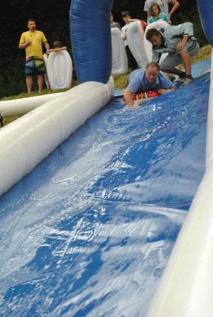 Ilminster Town FC fun day Part 2 – July 9, 2016: A giant water slide was the star attraction at a family fun day held to celebrate Ilminster Town Football Club’s new Archie Gooch Pavilion headquarters in Britten’s Field. Photo 17