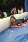 Ilminster Town FC fun day Part 2 – July 9, 2016: A giant water slide was the star attraction at a family fun day held to celebrate Ilminster Town Football Club’s new Archie Gooch Pavilion headquarters in Britten’s Field. Photo 1