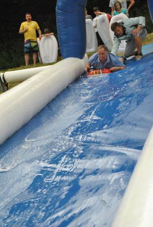 Ilminster Town FC fun day Part 2 – July 9, 2016: A giant water slide was the star attraction at a family fun day held to celebrate Ilminster Town Football Club’s new Archie Gooch Pavilion headquarters in Britten’s Field. Photo 18