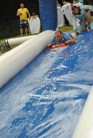 Ilminster Town FC fun day Part 2 – July 9, 2016: A giant water slide was the star attraction at a family fun day held to celebrate Ilminster Town Football Club’s new Archie Gooch Pavilion headquarters in Britten’s Field. Photo 19