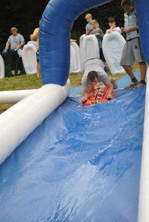 Ilminster Town FC fun day Part 2 – July 9, 2016: A giant water slide was the star attraction at a family fun day held to celebrate Ilminster Town Football Club’s new Archie Gooch Pavilion headquarters in Britten’s Field. Photo 22