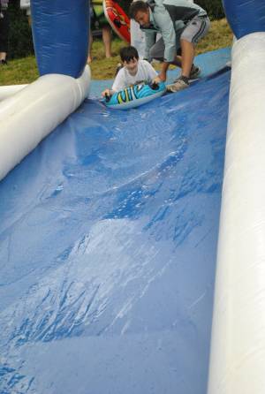 Ilminster Town FC fun day Part 2 – July 9, 2016: A giant water slide was the star attraction at a family fun day held to celebrate Ilminster Town Football Club’s new Archie Gooch Pavilion headquarters in Britten’s Field. Photo 26
