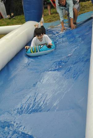 Ilminster Town FC fun day Part 2 – July 9, 2016: A giant water slide was the star attraction at a family fun day held to celebrate Ilminster Town Football Club’s new Archie Gooch Pavilion headquarters in Britten’s Field. Photo 27