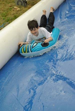 Ilminster Town FC fun day Part 2 – July 9, 2016: A giant water slide was the star attraction at a family fun day held to celebrate Ilminster Town Football Club’s new Archie Gooch Pavilion headquarters in Britten’s Field. Photo 28