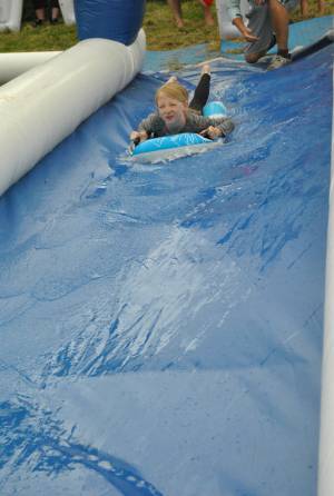 Ilminster Town FC fun day Part 2 – July 9, 2016: A giant water slide was the star attraction at a family fun day held to celebrate Ilminster Town Football Club’s new Archie Gooch Pavilion headquarters in Britten’s Field. Photo 30