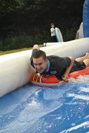 Ilminster Town FC fun day Part 2 – July 9, 2016: A giant water slide was the star attraction at a family fun day held to celebrate Ilminster Town Football Club’s new Archie Gooch Pavilion headquarters in Britten’s Field. Photo 7
