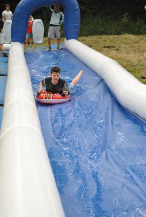 Ilminster Town FC fun day Part 3 – July 9, 2016: A giant water slide was the star attraction at a family fun day held to celebrate Ilminster Town Football Club’s new Archie Gooch Pavilion headquarters in Britten’s Field. Photo 11