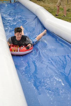 Ilminster Town FC fun day Part 3 – July 9, 2016: A giant water slide was the star attraction at a family fun day held to celebrate Ilminster Town Football Club’s new Archie Gooch Pavilion headquarters in Britten’s Field. Photo 12