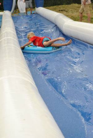 Ilminster Town FC fun day Part 3 – July 9, 2016: A giant water slide was the star attraction at a family fun day held to celebrate Ilminster Town Football Club’s new Archie Gooch Pavilion headquarters in Britten’s Field. Photo 14