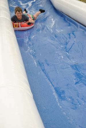 Ilminster Town FC fun day Part 3 – July 9, 2016: A giant water slide was the star attraction at a family fun day held to celebrate Ilminster Town Football Club’s new Archie Gooch Pavilion headquarters in Britten’s Field. Photo 15