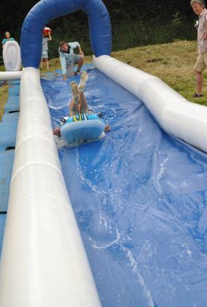 Ilminster Town FC fun day Part 3 – July 9, 2016: A giant water slide was the star attraction at a family fun day held to celebrate Ilminster Town Football Club’s new Archie Gooch Pavilion headquarters in Britten’s Field. Photo 17