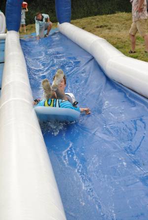 Ilminster Town FC fun day Part 3 – July 9, 2016: A giant water slide was the star attraction at a family fun day held to celebrate Ilminster Town Football Club’s new Archie Gooch Pavilion headquarters in Britten’s Field. Photo 18