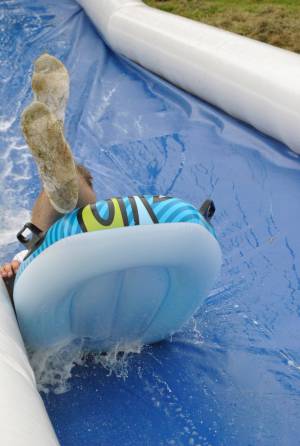 Ilminster Town FC fun day Part 3 – July 9, 2016: A giant water slide was the star attraction at a family fun day held to celebrate Ilminster Town Football Club’s new Archie Gooch Pavilion headquarters in Britten’s Field. Photo 19