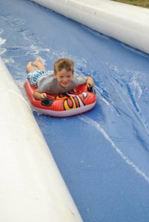 Ilminster Town FC fun day Part 3 – July 9, 2016: A giant water slide was the star attraction at a family fun day held to celebrate Ilminster Town Football Club’s new Archie Gooch Pavilion headquarters in Britten’s Field. Photo 20