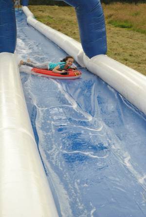 Ilminster Town FC fun day Part 3 – July 9, 2016: A giant water slide was the star attraction at a family fun day held to celebrate Ilminster Town Football Club’s new Archie Gooch Pavilion headquarters in Britten’s Field. Photo 21