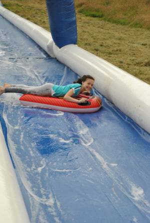 Ilminster Town FC fun day Part 3 – July 9, 2016: A giant water slide was the star attraction at a family fun day held to celebrate Ilminster Town Football Club’s new Archie Gooch Pavilion headquarters in Britten’s Field. Photo 22