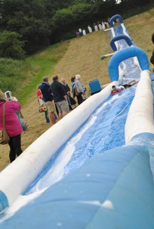 Ilminster Town FC fun day Part 3 – July 9, 2016: A giant water slide was the star attraction at a family fun day held to celebrate Ilminster Town Football Club’s new Archie Gooch Pavilion headquarters in Britten’s Field. Photo 23