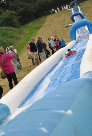 Ilminster Town FC fun day Part 3 – July 9, 2016: A giant water slide was the star attraction at a family fun day held to celebrate Ilminster Town Football Club’s new Archie Gooch Pavilion headquarters in Britten’s Field. Photo 24