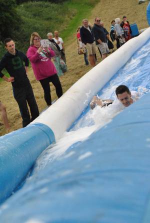 Ilminster Town FC fun day Part 3 – July 9, 2016: A giant water slide was the star attraction at a family fun day held to celebrate Ilminster Town Football Club’s new Archie Gooch Pavilion headquarters in Britten’s Field. Photo 25