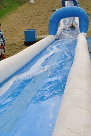 Ilminster Town FC fun day Part 3 – July 9, 2016: A giant water slide was the star attraction at a family fun day held to celebrate Ilminster Town Football Club’s new Archie Gooch Pavilion headquarters in Britten’s Field. Photo 26