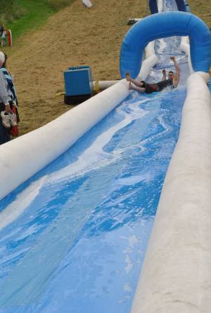 Ilminster Town FC fun day Part 3 – July 9, 2016: A giant water slide was the star attraction at a family fun day held to celebrate Ilminster Town Football Club’s new Archie Gooch Pavilion headquarters in Britten’s Field. Photo 27