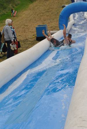 Ilminster Town FC fun day Part 3 – July 9, 2016: A giant water slide was the star attraction at a family fun day held to celebrate Ilminster Town Football Club’s new Archie Gooch Pavilion headquarters in Britten’s Field. Photo 28